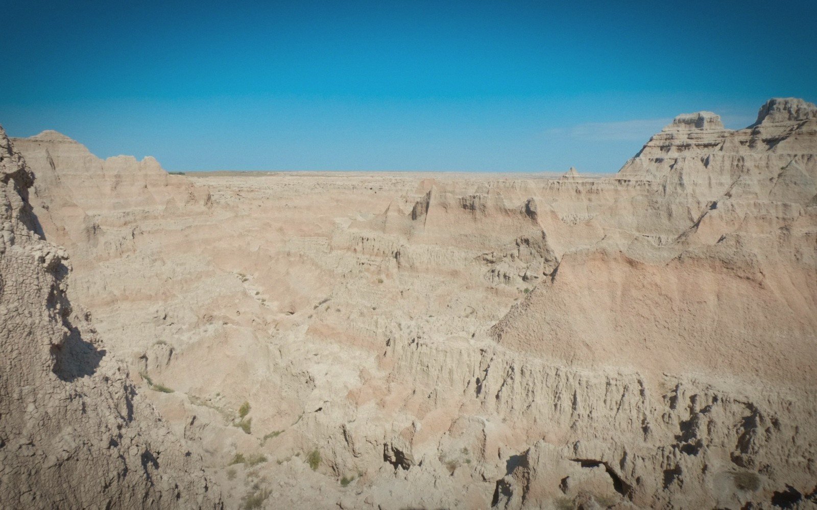 Eroded badlands strata lit by low sun